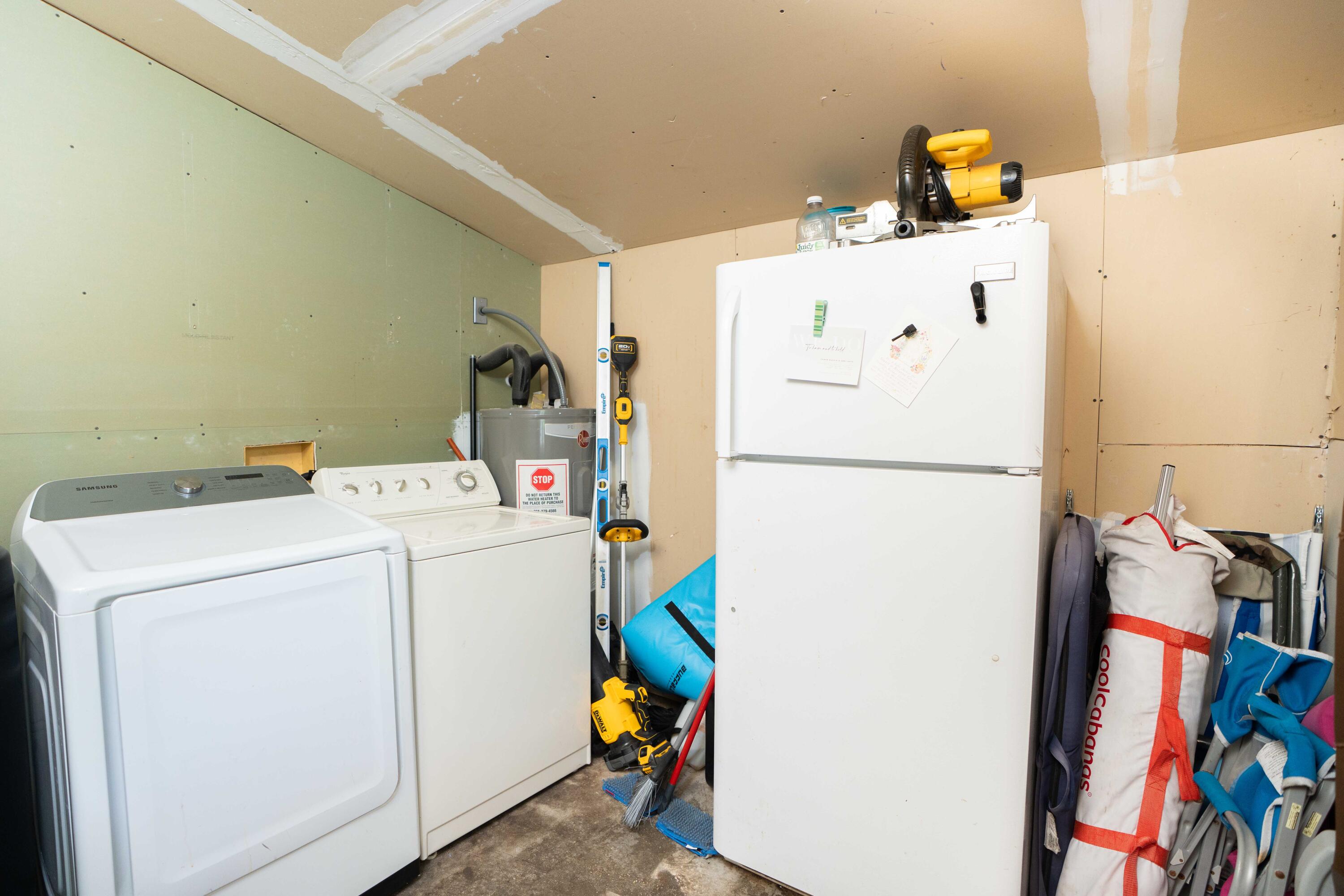 1849 Northwest Pine Tree Way Stuart, FL 34994 - Photo 16 of 29 a utility room with dryer and washer