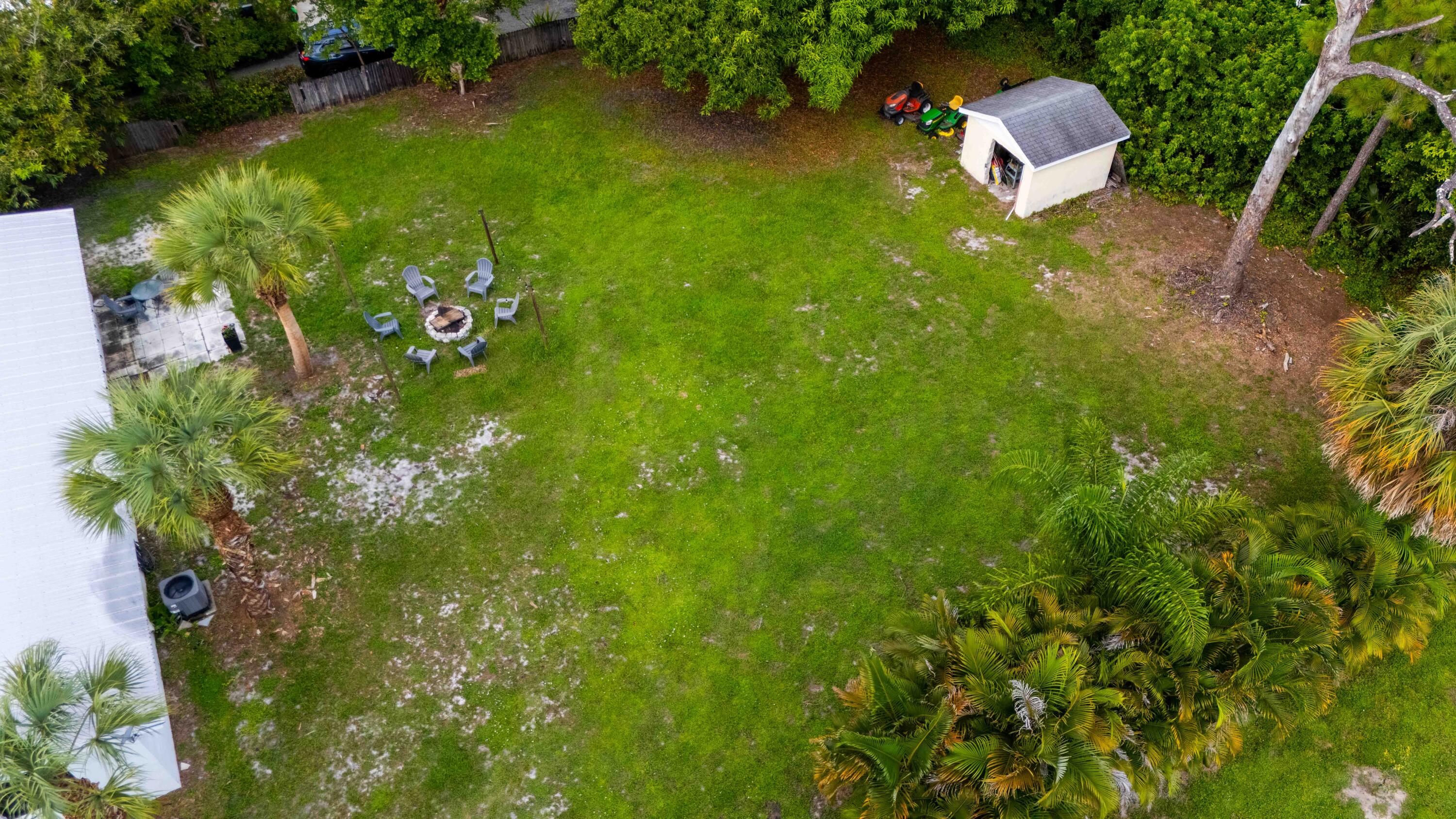 1849 Northwest Pine Tree Way Stuart, FL 34994 - Photo 21 of 29 a backyard of a house with lots of green space