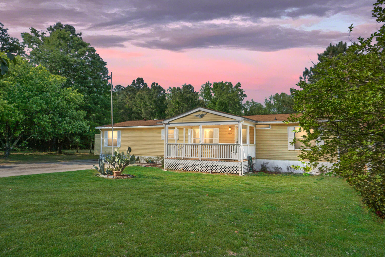 220 Oakley Road Moncks Corner, SC 29461 - Photo 1 of 31 220 Oakley Rd at sunset