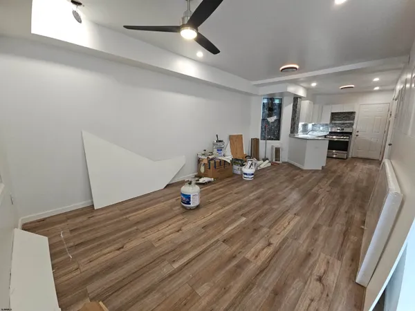 a kitchen with granite countertop cabinets stainless steel appliances and a counter space