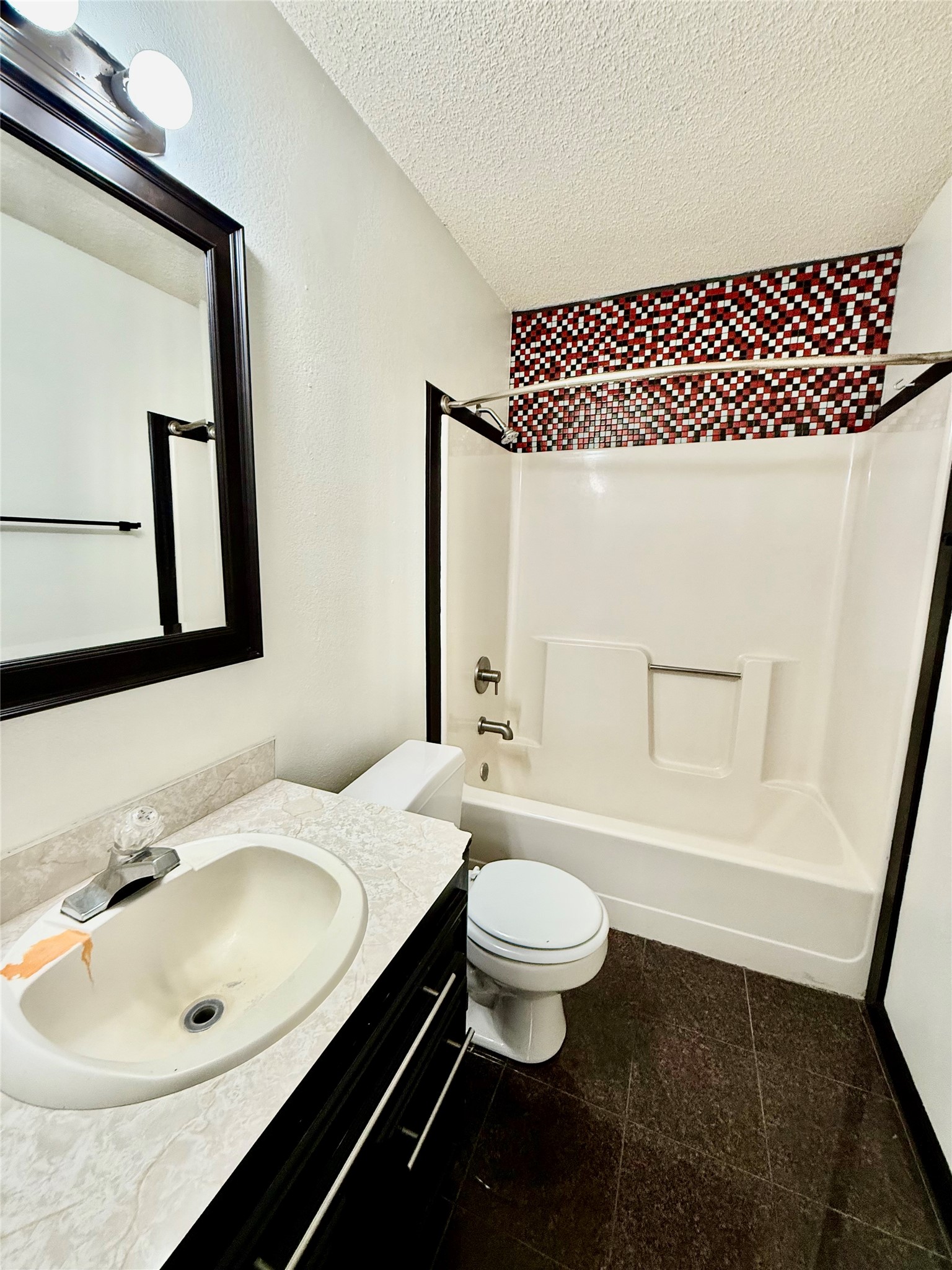 2206 87th Street Lubbock, TX 79423 - Photo 9 of 13 a bathroom with a sink and a mirror