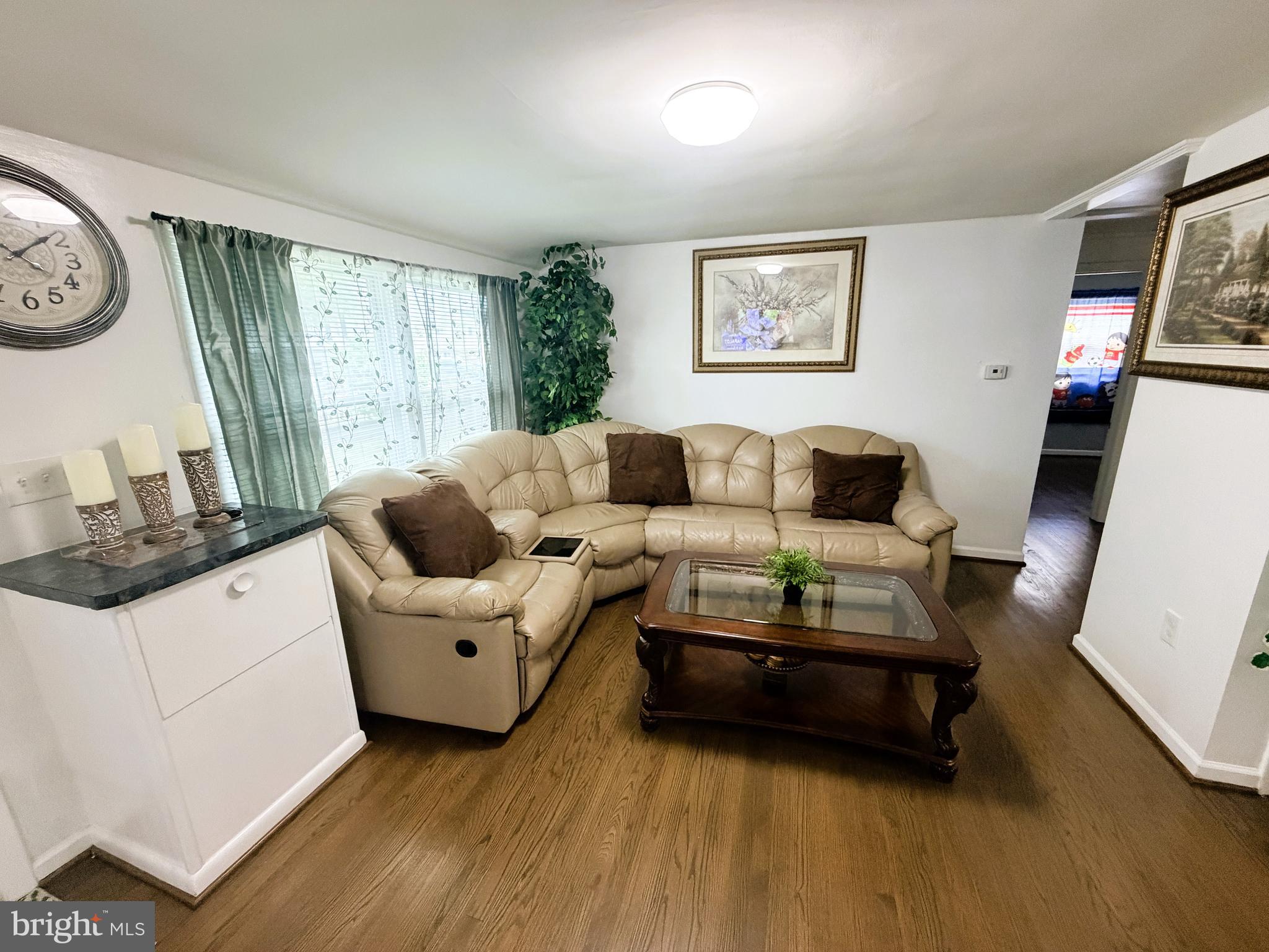 7403 S Road Rosedale, MD 21237 - Photo 14 of 27 a living room with furniture and a large window