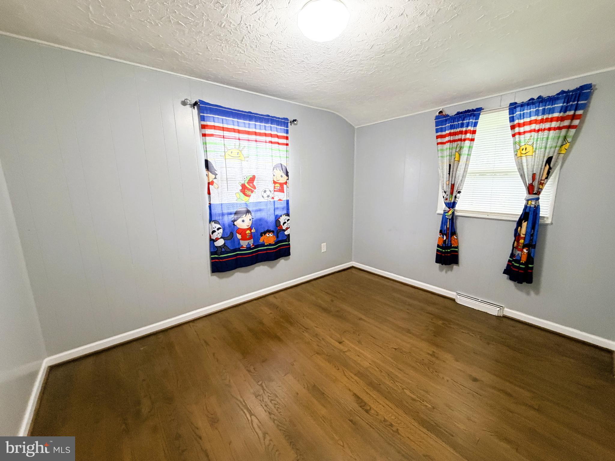 7403 S Road Rosedale, MD 21237 - Photo 20 of 27 a living room with furniture and a flat screen tv