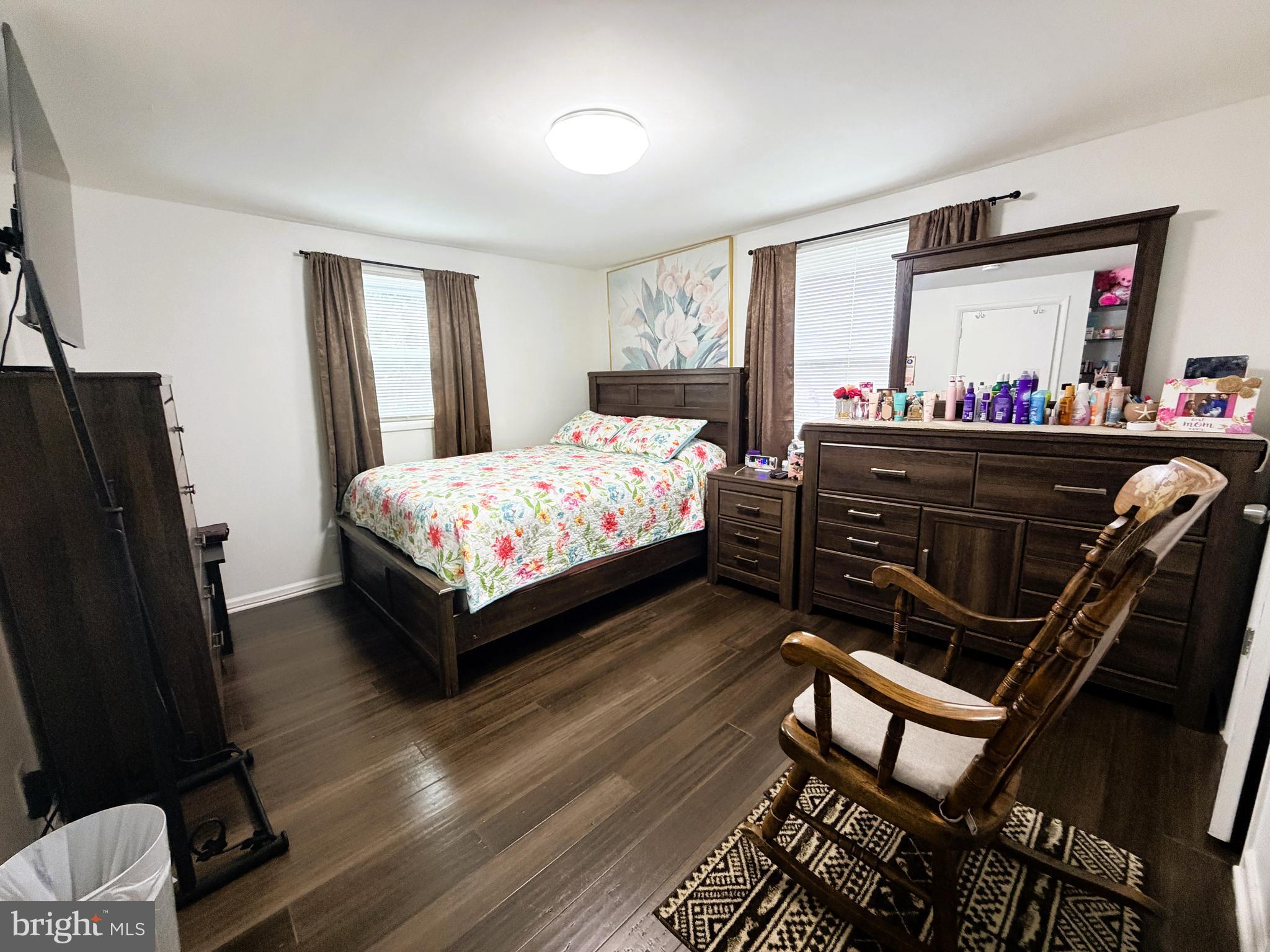 7403 S Road Rosedale, MD 21237 - Photo 23 of 27 a bedroom with a bed and wooden floor