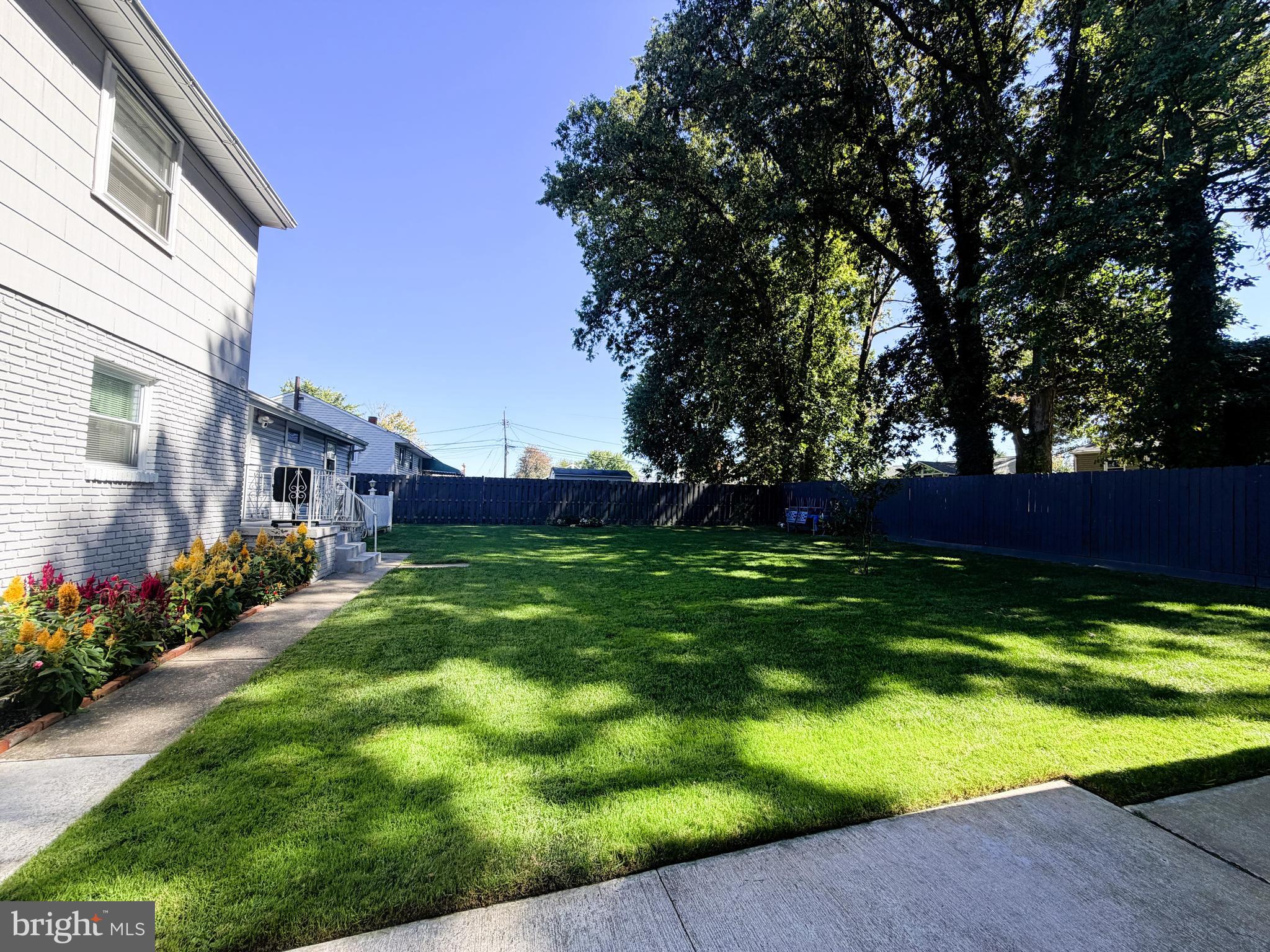 7403 S Road Rosedale, MD 21237 - Photo 24 of 27 a view of a house with a backyard