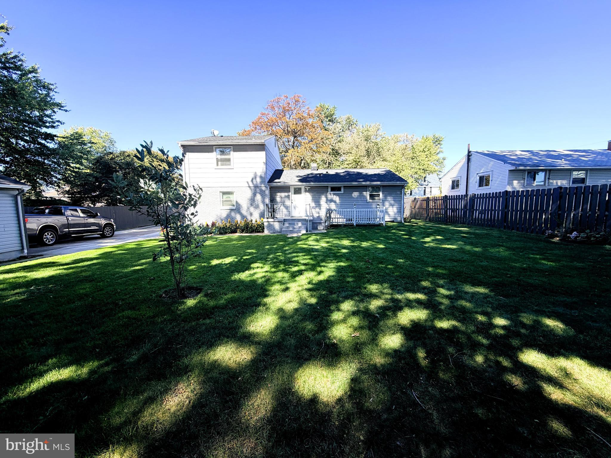 7403 S Road Rosedale, MD 21237 - Photo 26 of 27 a view of a big yard next to a house