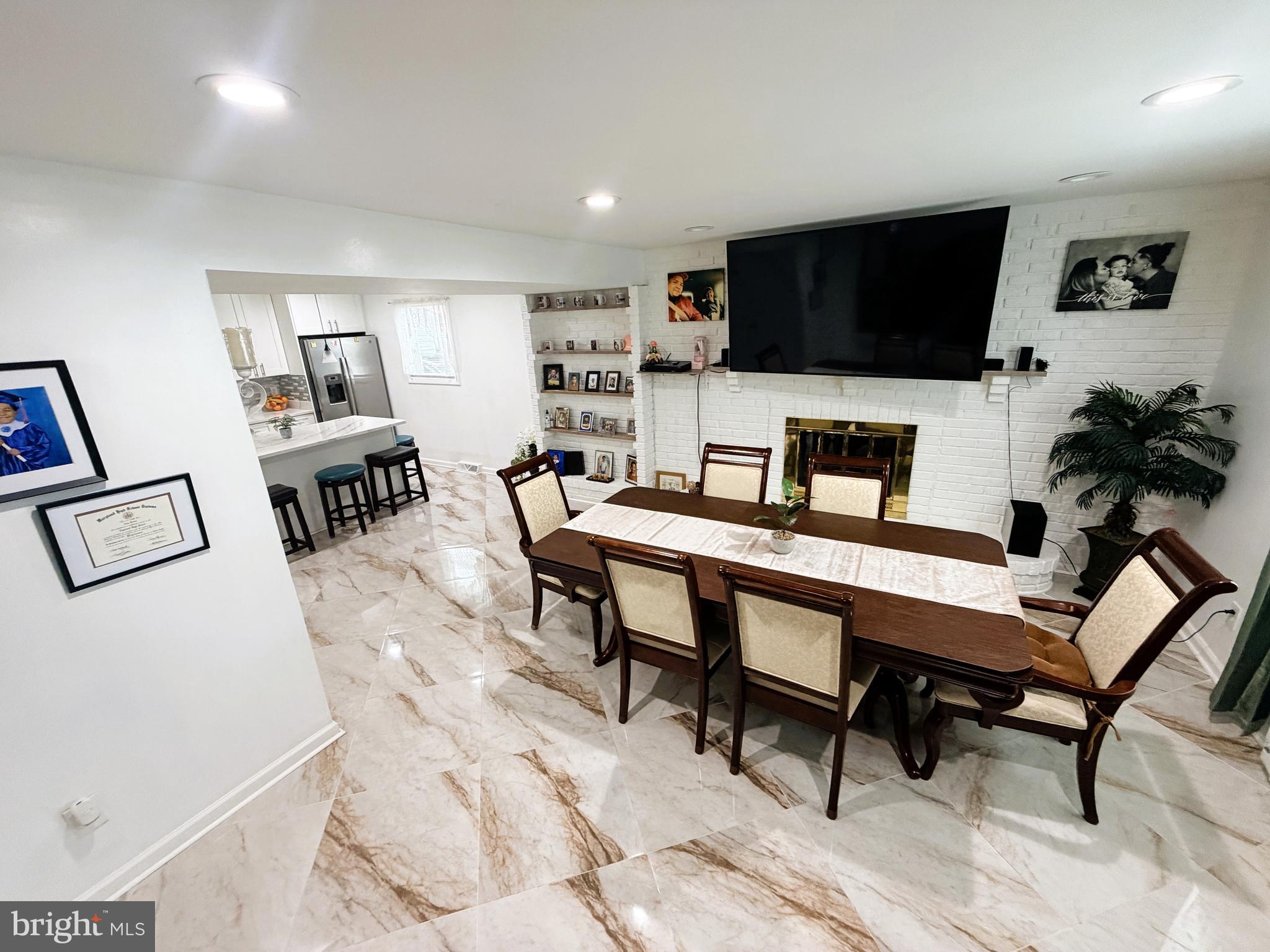 7403 S Road Rosedale, MD 21237 - Photo 7 of 27 a living room with furniture and a flat screen tv