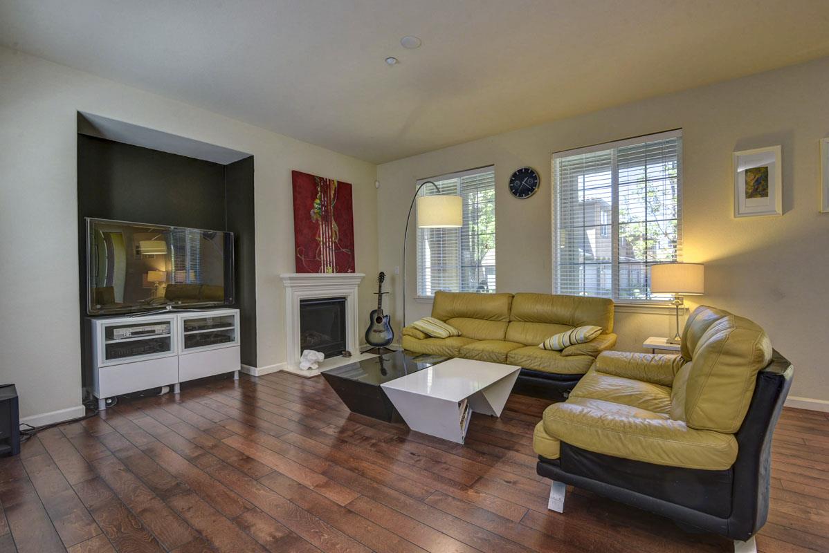 5373 Fioli Loop San Ramon, CA 94582 - Photo 4 of 31 a living room with fireplace furniture and a wooden floor