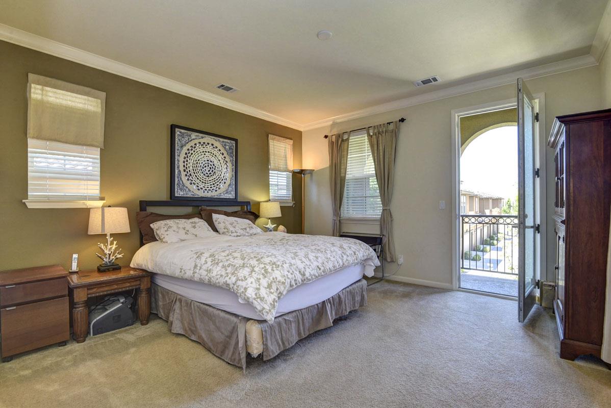 5373 Fioli Loop San Ramon, CA 94582 - Photo 10 of 31 a bedroom with a bed painting and a window