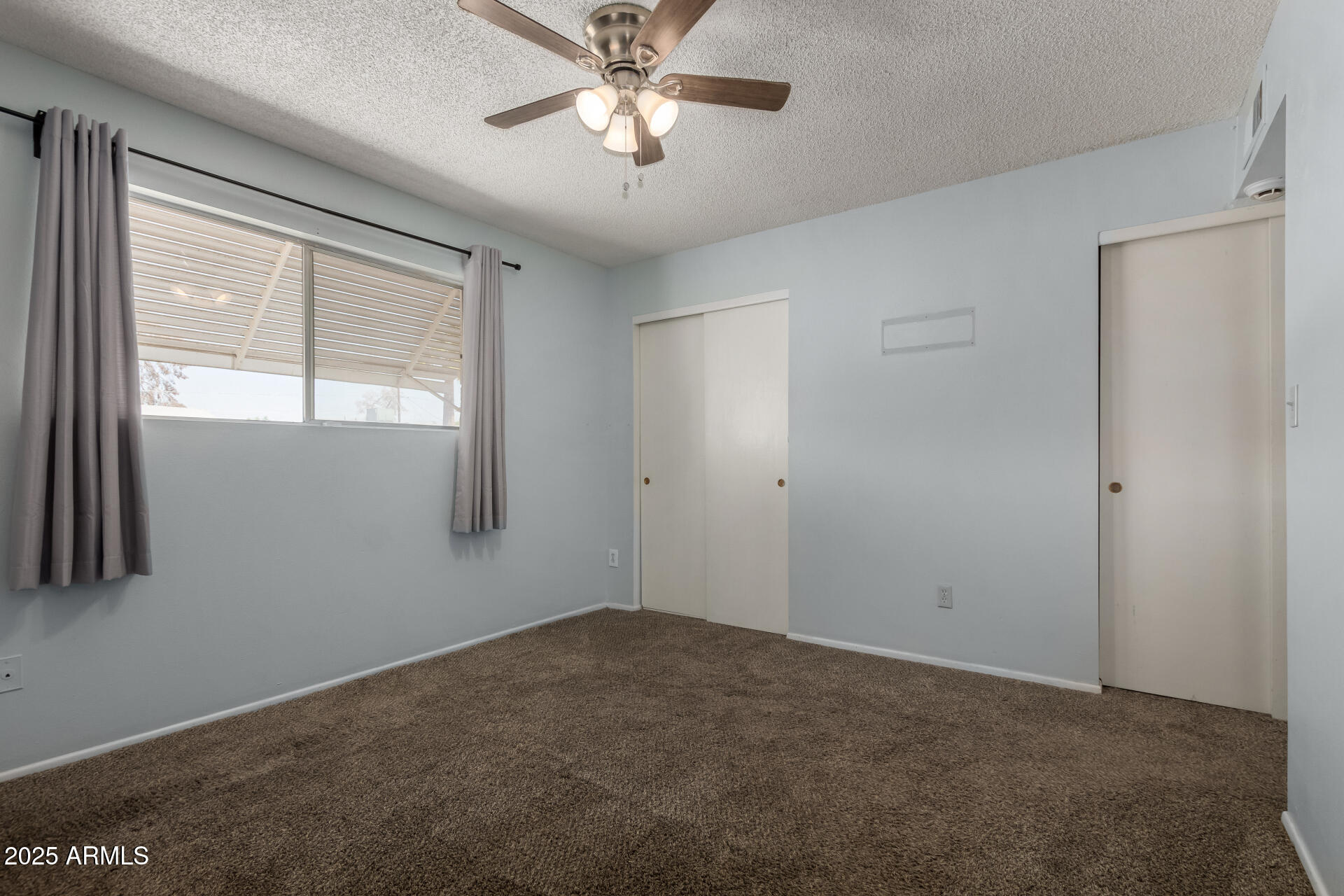 1510 South Lawther Drive Apache Junction, AZ 85120 - Photo 23 of 30 a view of empty room with window