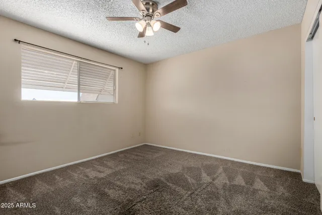a view of a patio with table and chairs potted plants with wooden floor