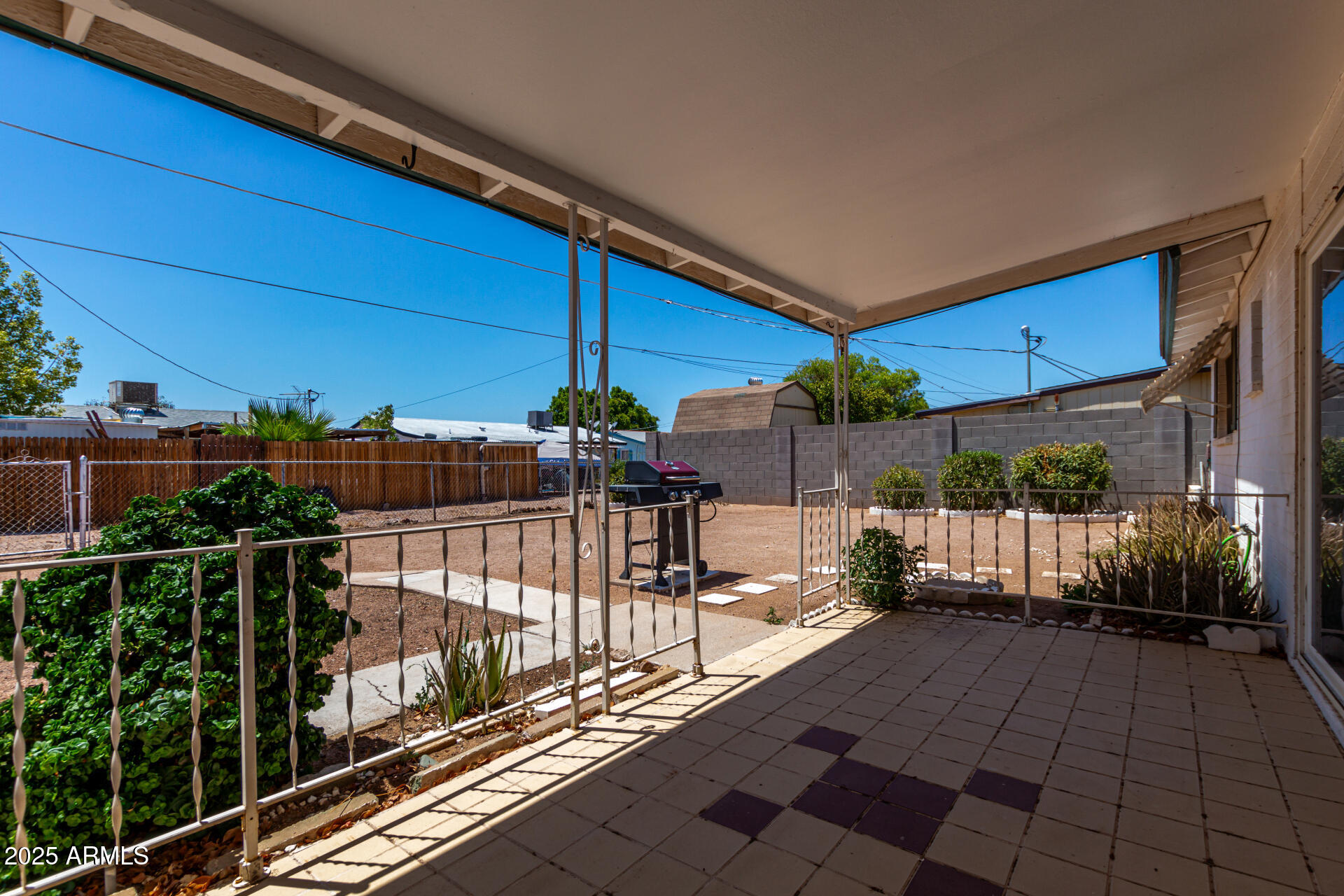 1510 South Lawther Drive Apache Junction, AZ 85120 - Photo 26 of 30 a view of a patio with table and chairs potted plants with wooden floor