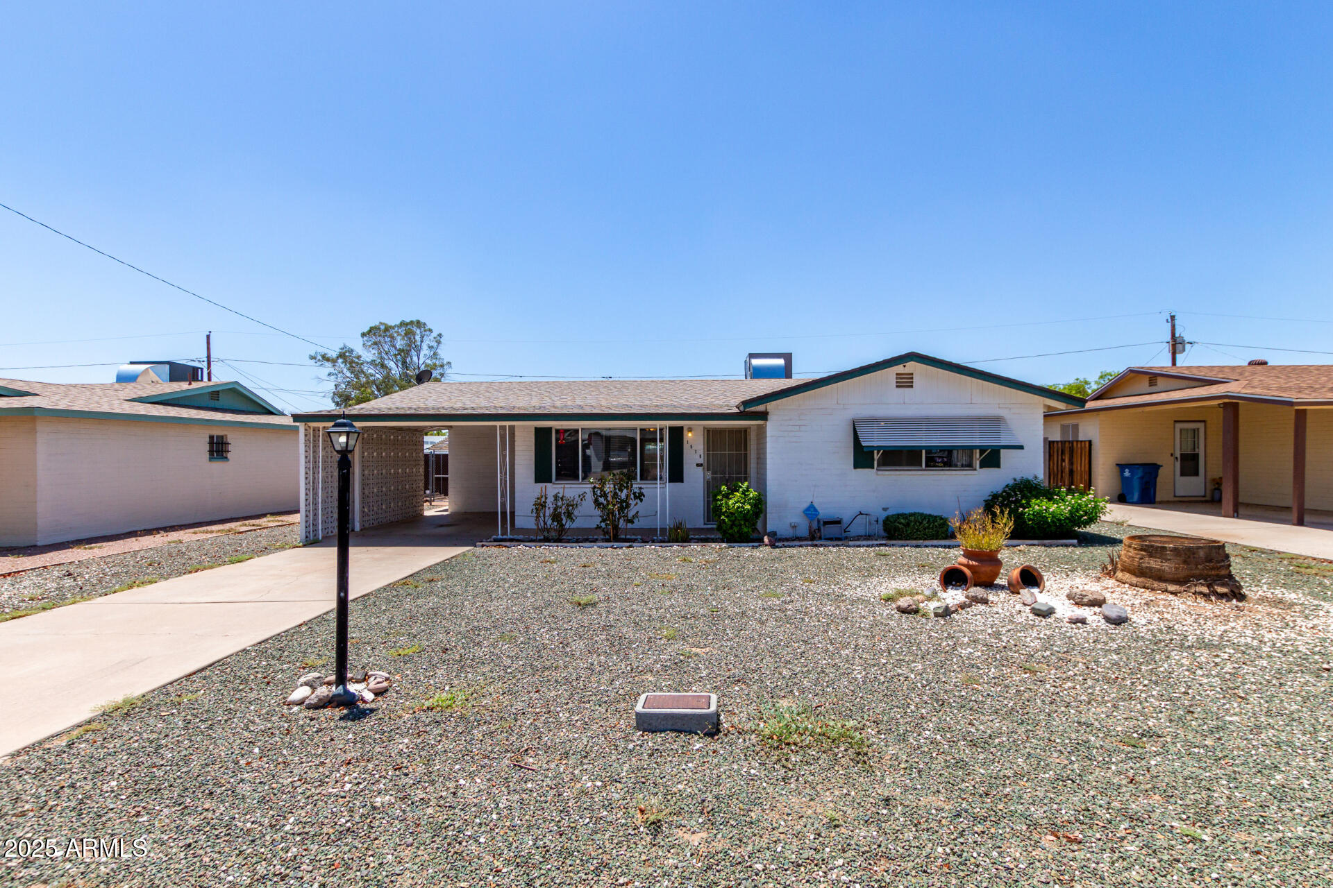 1510 South Lawther Drive Apache Junction, AZ 85120 - Photo 28 of 30 a front view of a house with a yard
