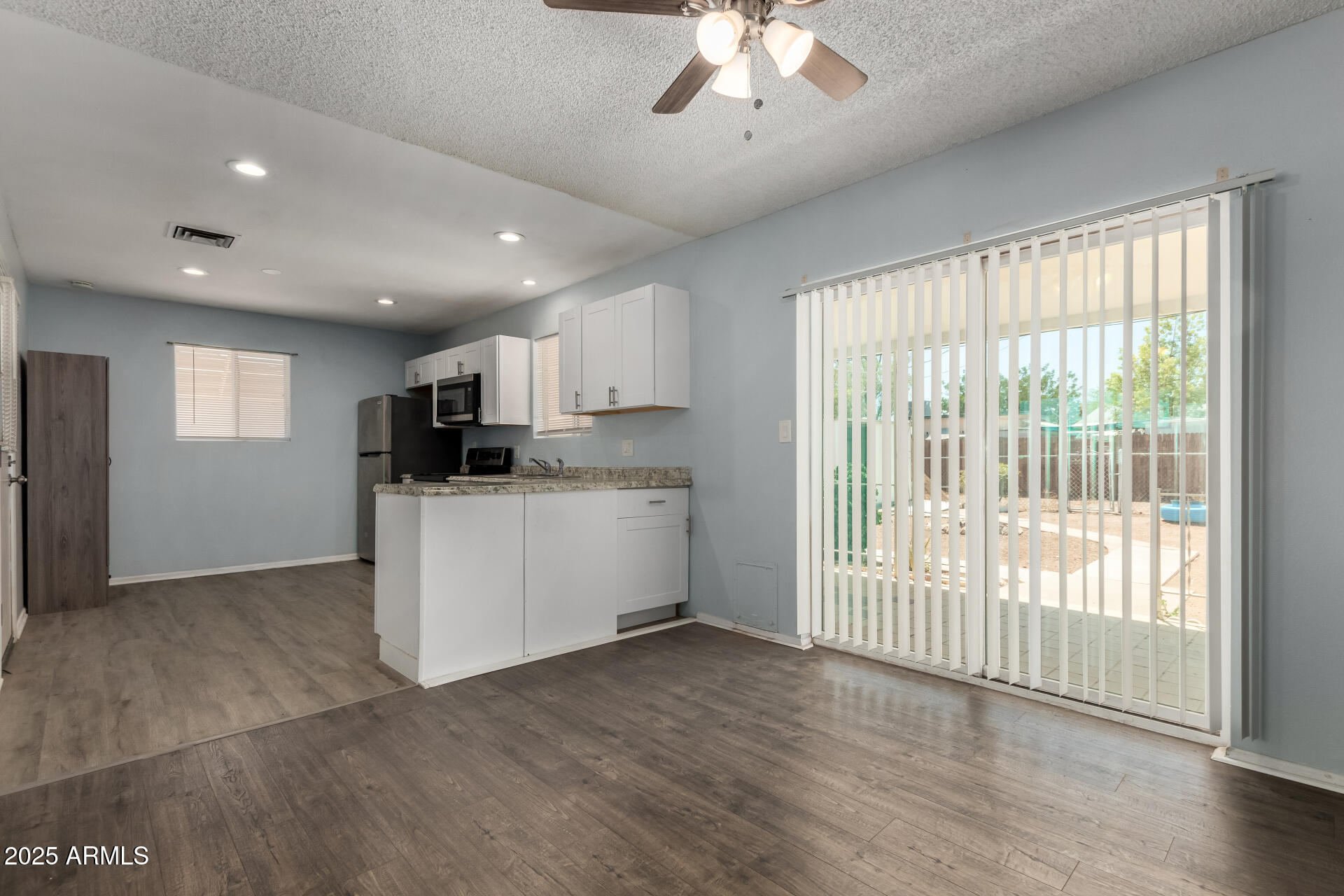 1510 South Lawther Drive Apache Junction, AZ 85120 - Photo 7 of 30 a view of kitchen with stainless steel appliances refrigerator oven and cabinets