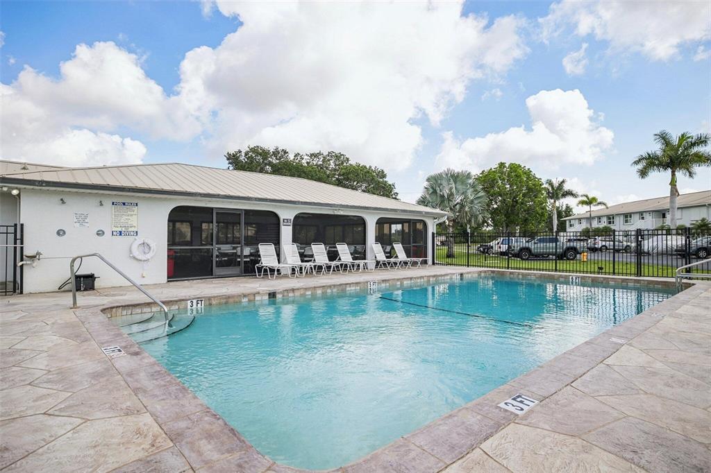 26485 Rampart Boulevard, Unit A27 Punta Gorda, FL 33983 - Photo 6 of 27 a view of a house with swimming pool and a yard