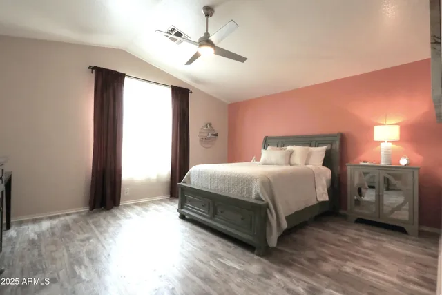 a bed room with a bed and a television