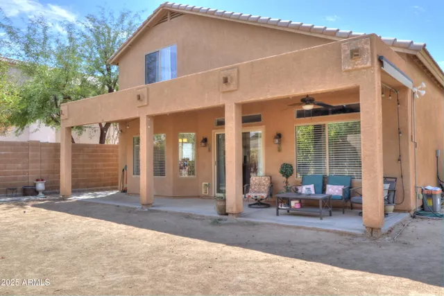 a backyard of a house with seating space
