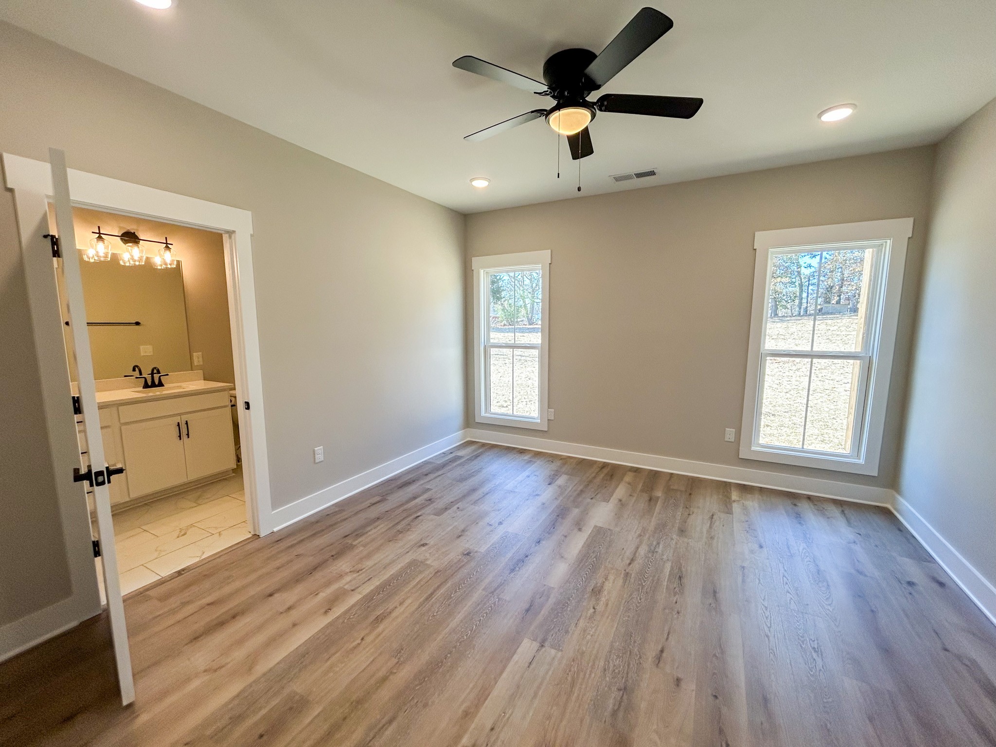 977 Hoodoo Road Beechgrove, TN 37018 - Photo 12 of 22 wooden floor in an empty room with a window