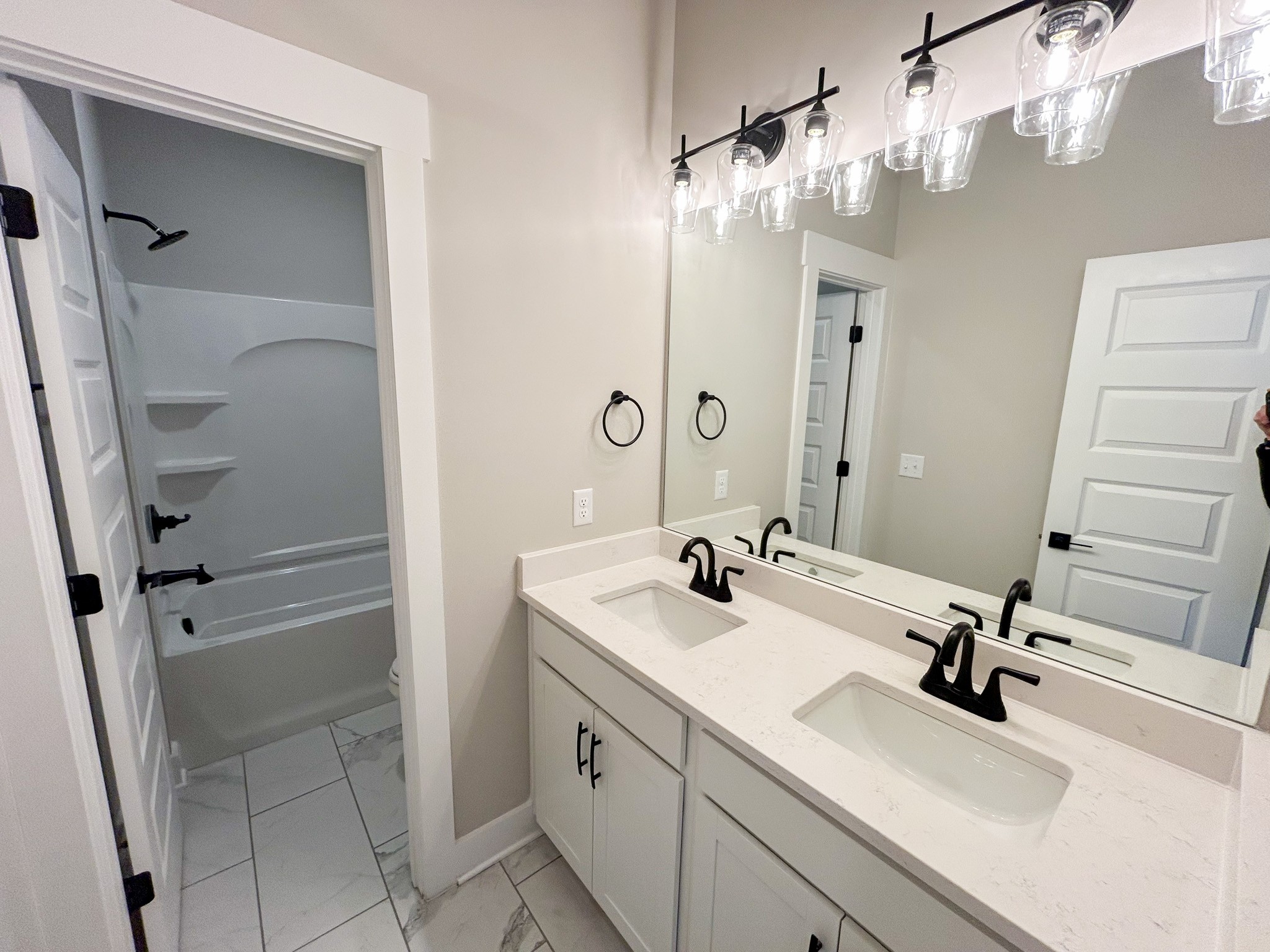977 Hoodoo Road Beechgrove, TN 37018 - Photo 15 of 22 a bathroom with a sink a vanity a mirror and shower