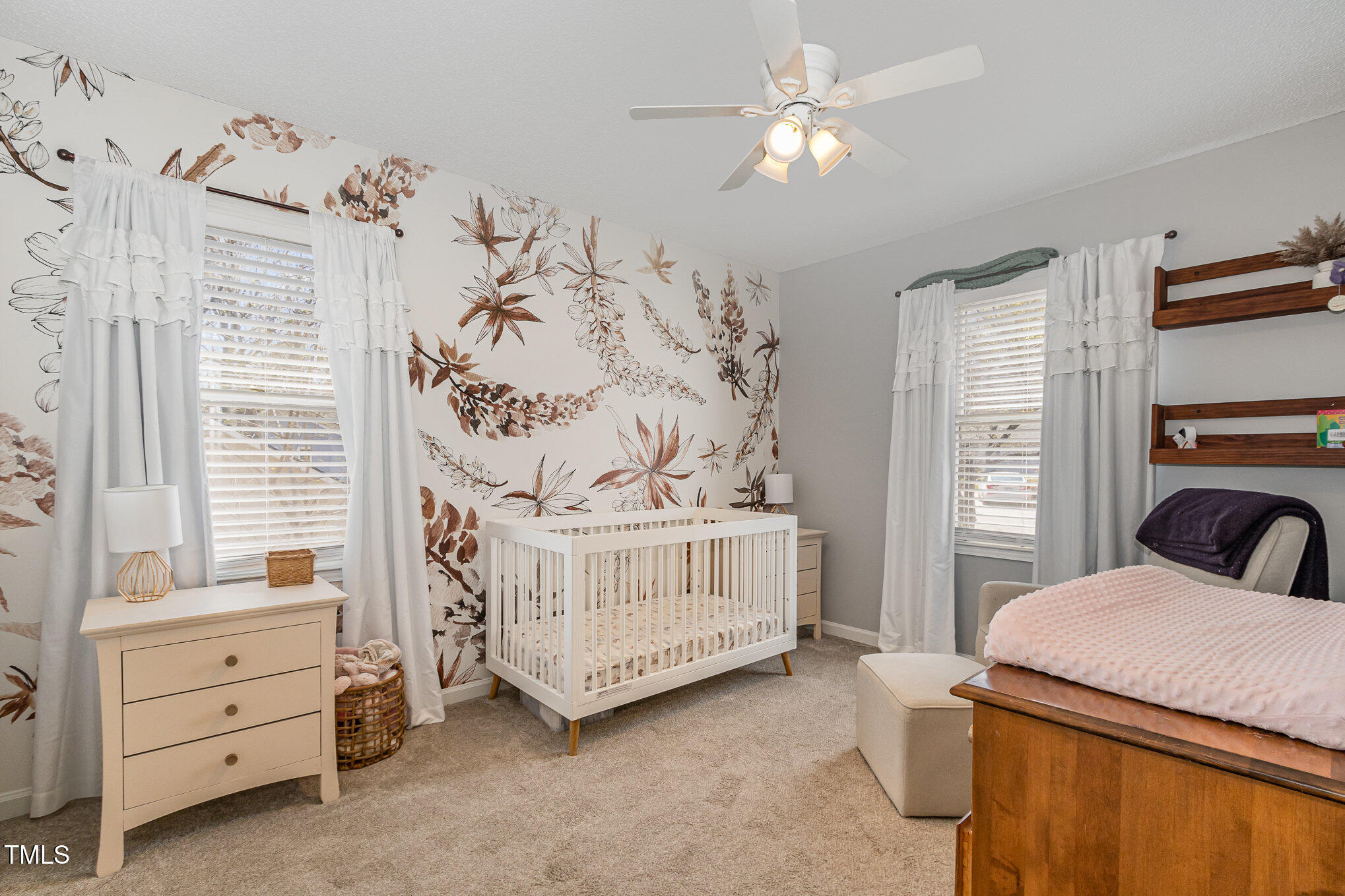 7708 Foxwood Drive Raleigh, NC 27615 - Photo 15 of 25 a bedroom with a baby bed dresser and a window