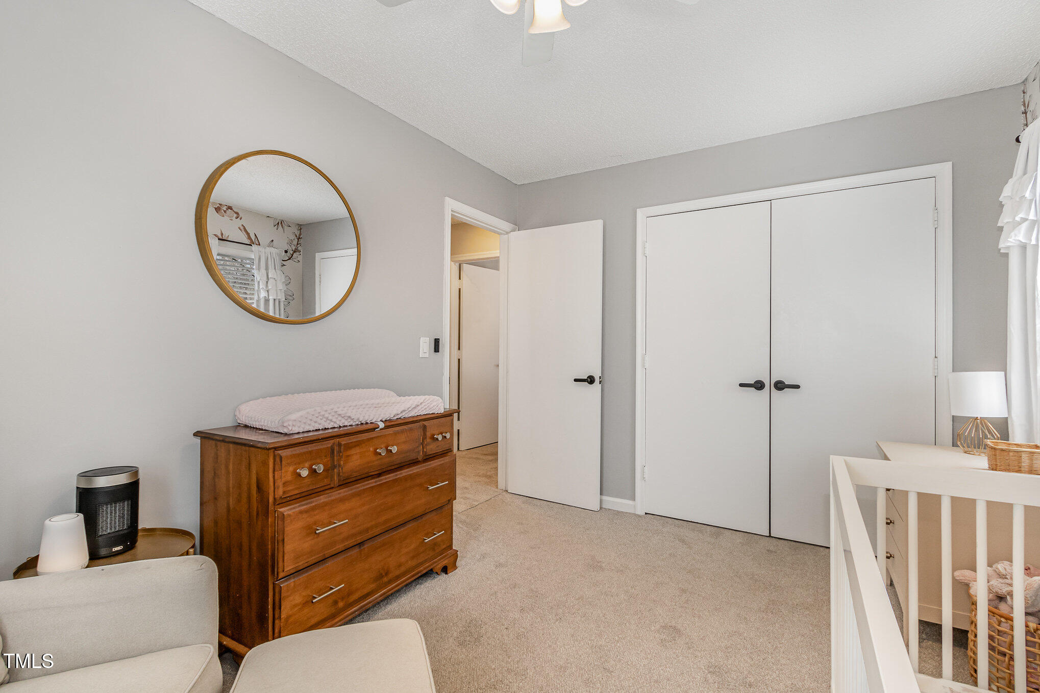7708 Foxwood Drive Raleigh, NC 27615 - Photo 16 of 25 a bathroom with a toilet a sink and a mirror