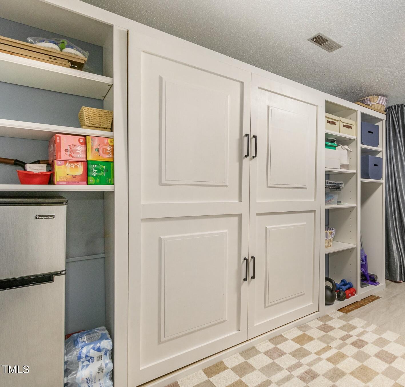 7708 Foxwood Drive Raleigh, NC 27615 - Photo 19 of 25 a room with closet and a window
