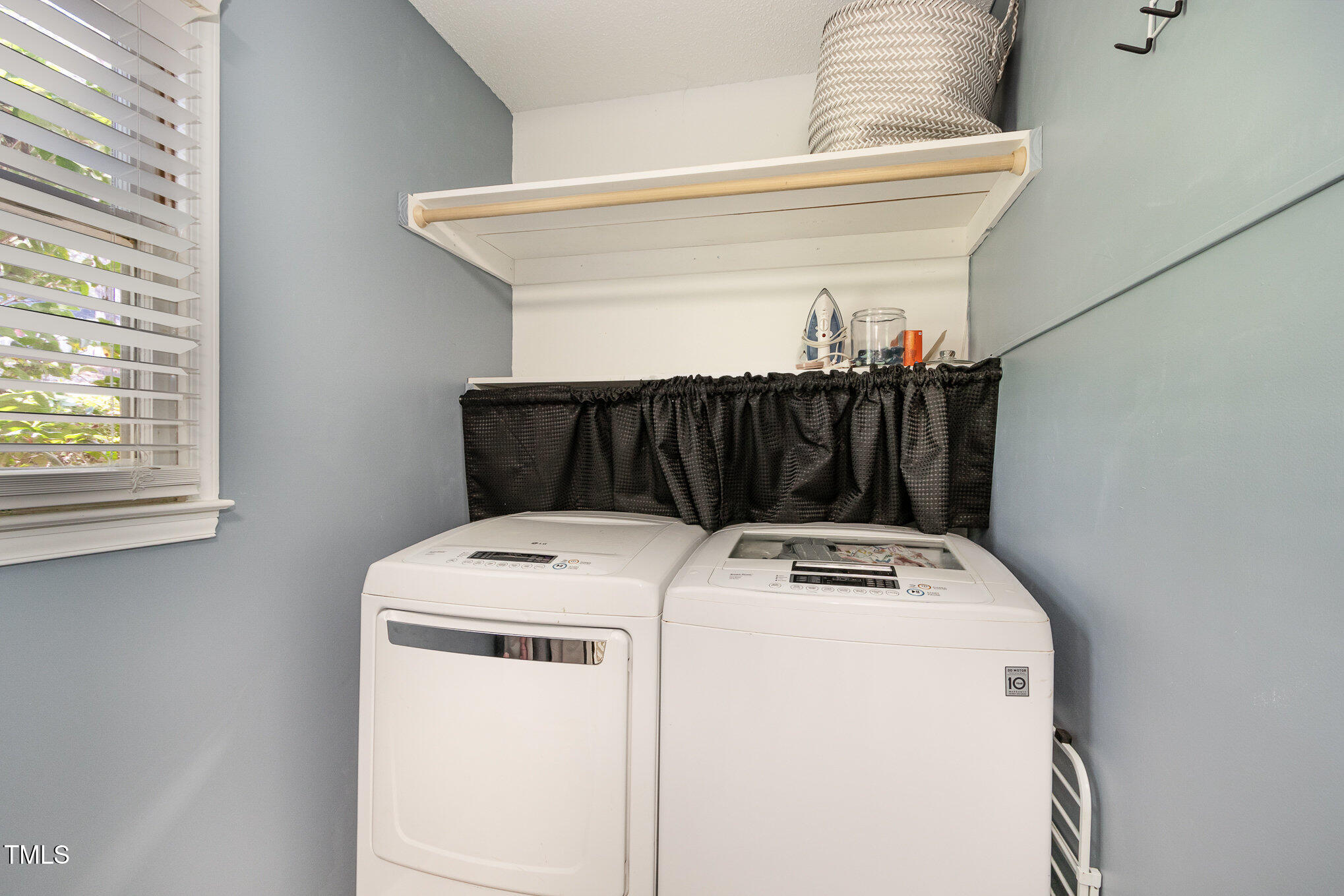 7708 Foxwood Drive Raleigh, NC 27615 - Photo 23 of 25 a utility room with dryer and washer