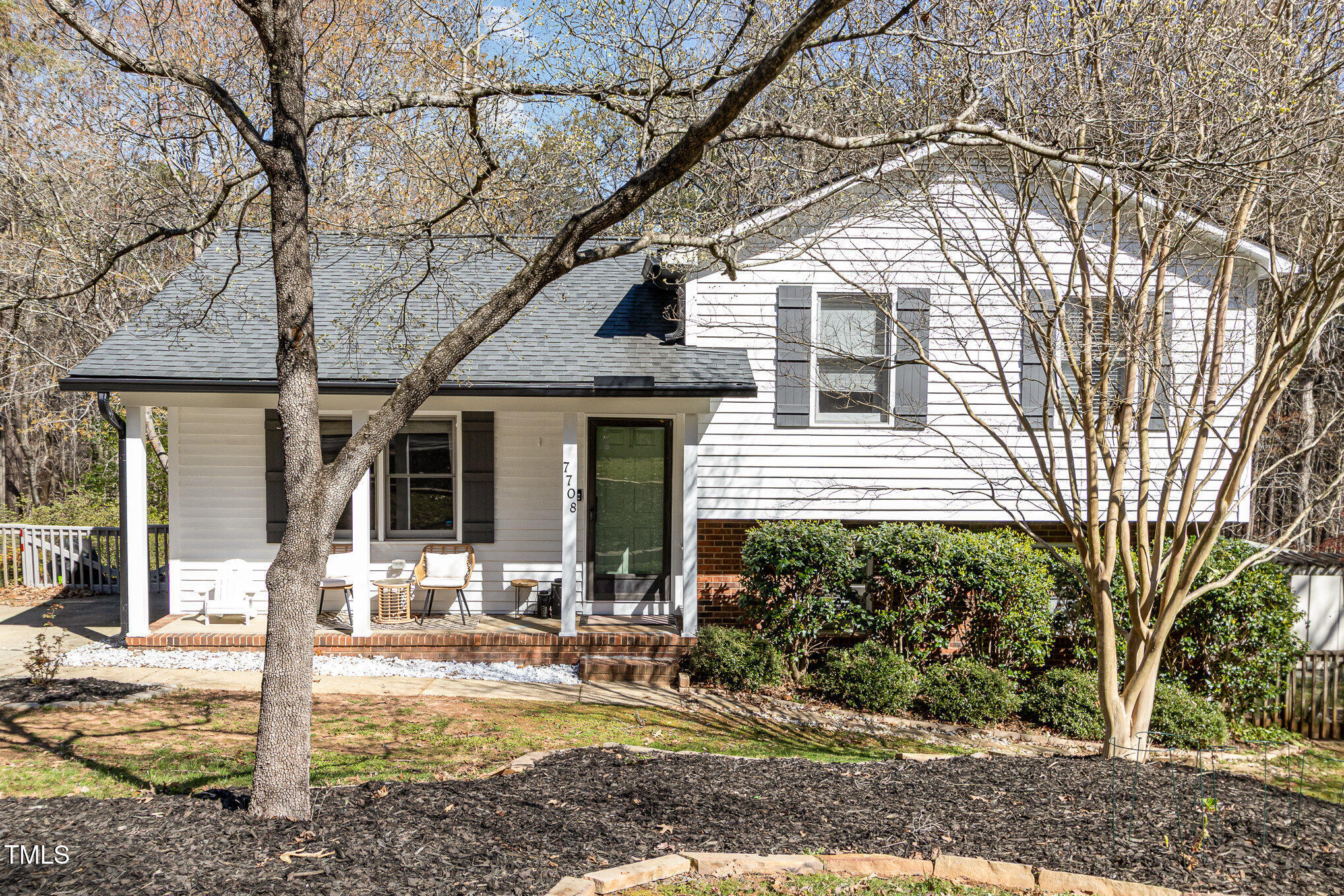 7708 Foxwood Drive Raleigh, NC 27615 - Photo 25 of 25 a front view of a house with garden