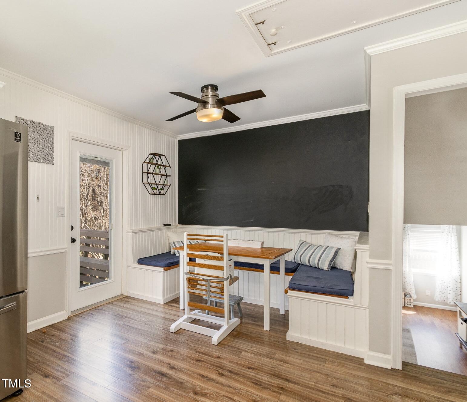 7708 Foxwood Drive Raleigh, NC 27615 - Photo 5 of 25 a living room with furniture and a flat screen tv