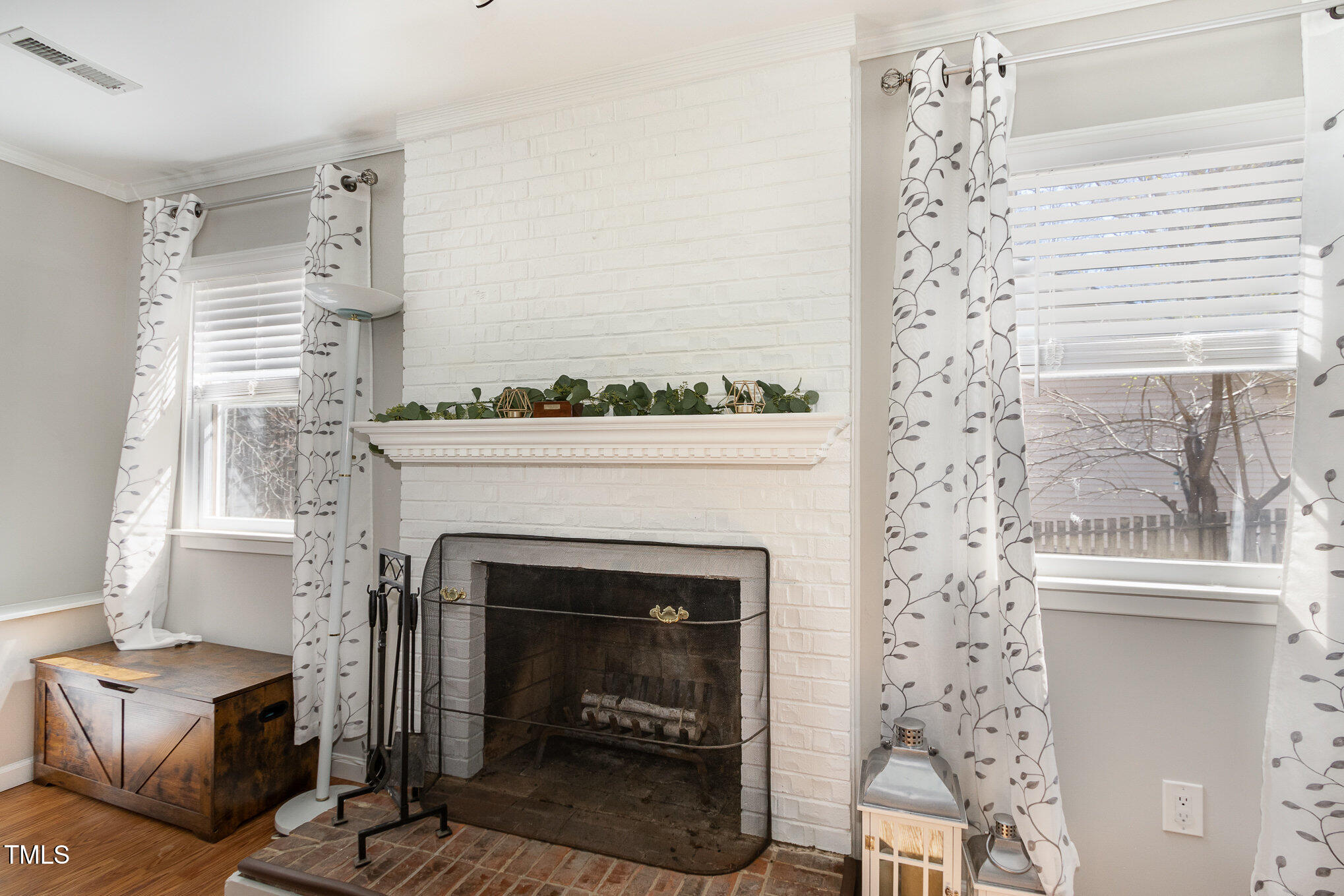 7708 Foxwood Drive Raleigh, NC 27615 - Photo 10 of 25 a living room with furniture and a fireplace