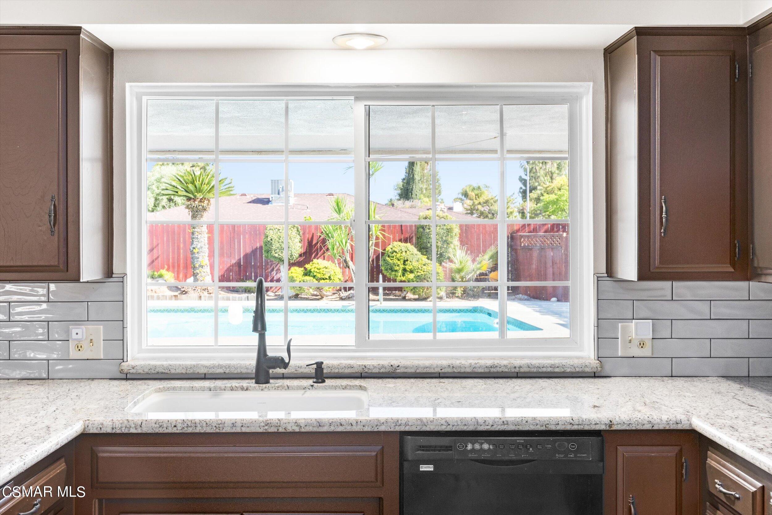 3512 Crest Drive Bakersfield, CA 93306 - Photo 24 of 40 a kitchen with a sink and a large window