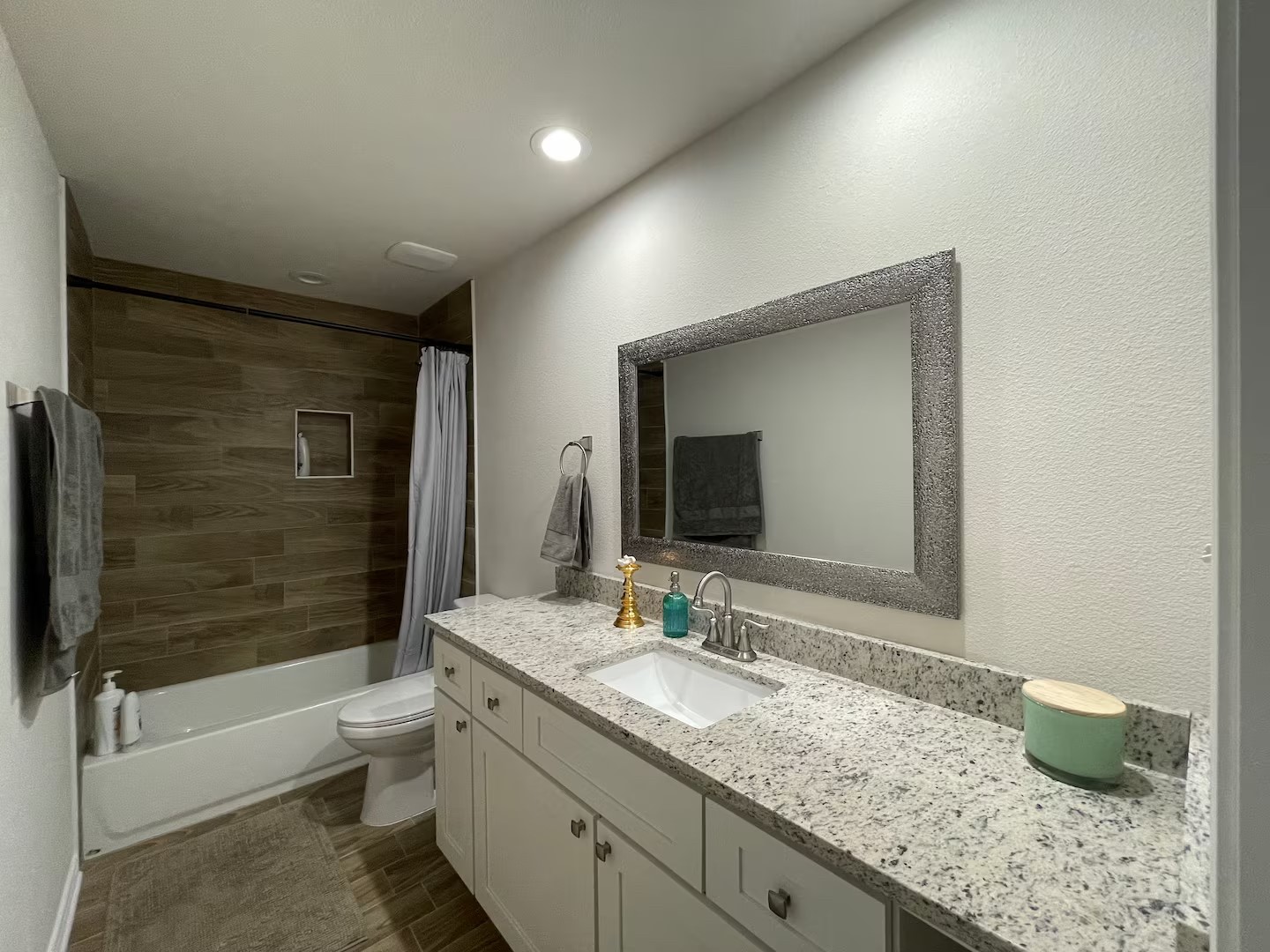 2540 Contour Drive Spring Branch, TX 78070 - Photo 11 of 12 a bathroom with a granite countertop sink a toilet and shower