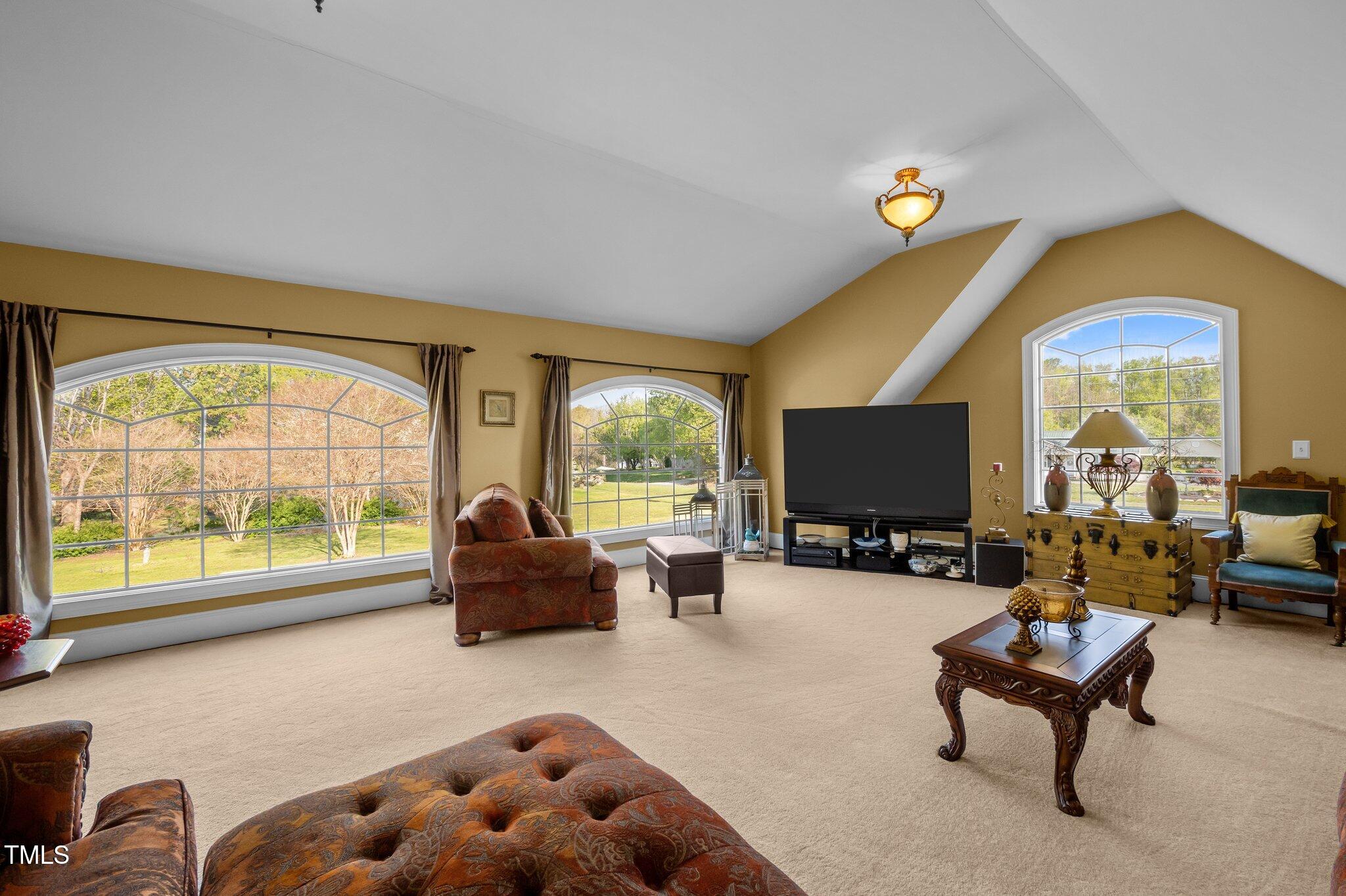 1174 Robertson Road Roxboro, NC 27574 - Photo 32 of 58 a living room with furniture and a large window