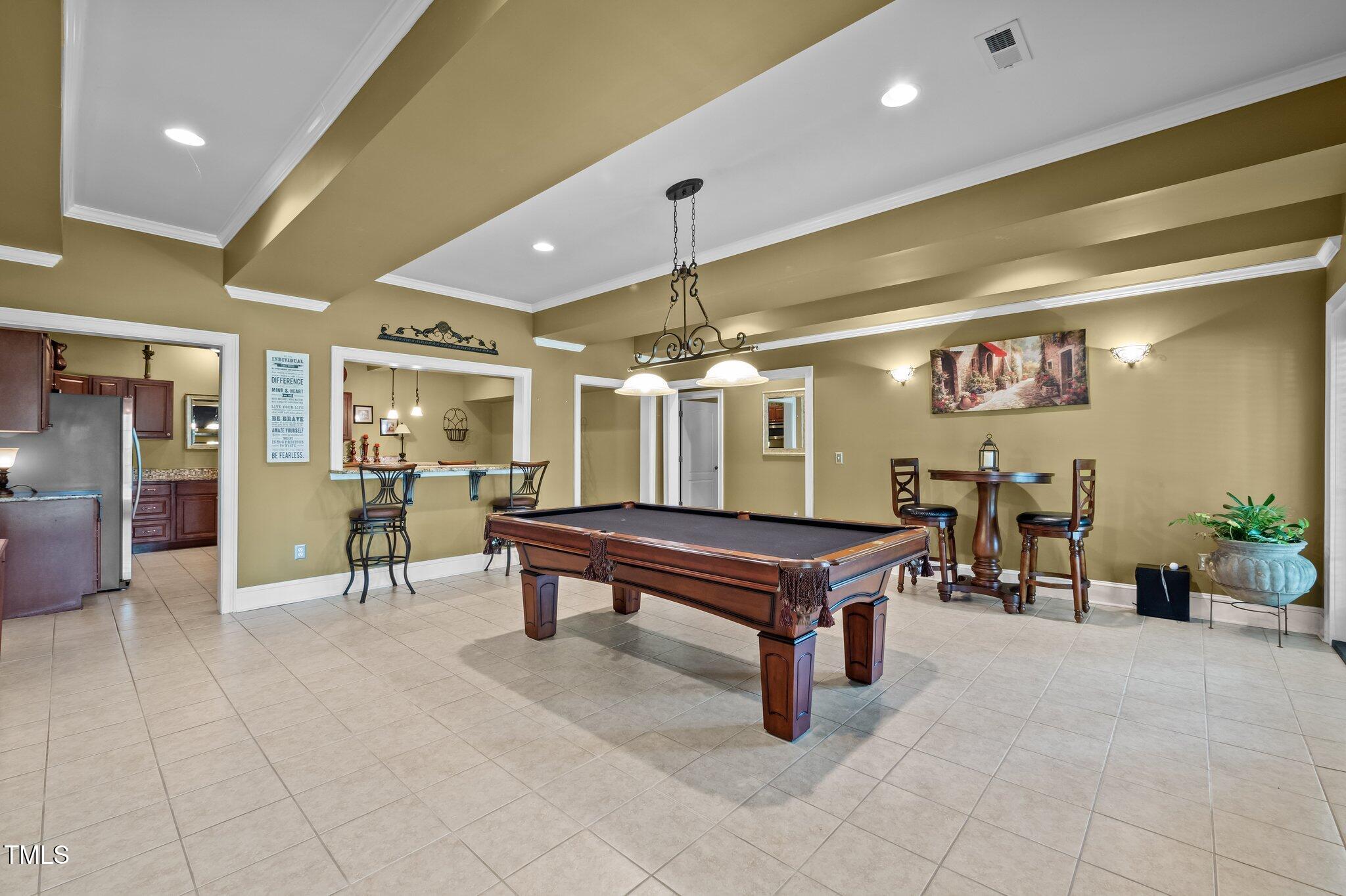 1174 Robertson Road Roxboro, NC 27574 - Photo 38 of 58 a room with lots of tables and chairs