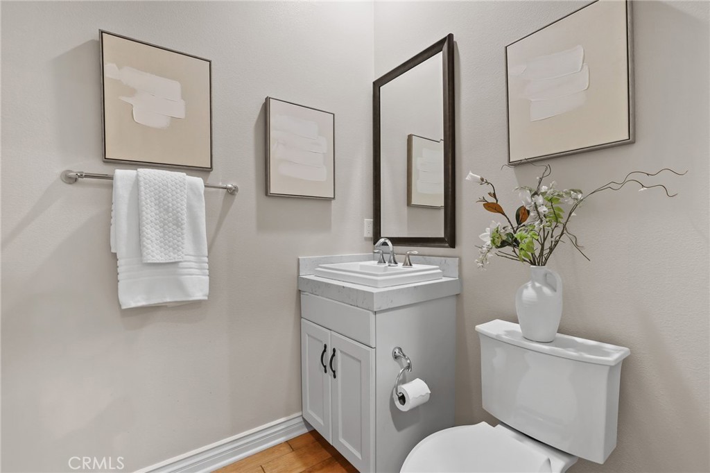 10 Shadybend Irvine, CA 92602 - Photo 25 of 70 a bathroom with a toilet sink and mirror
