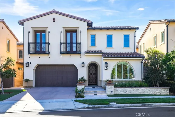 a living room with lots of wooden furniture and a dining table with wooden floor