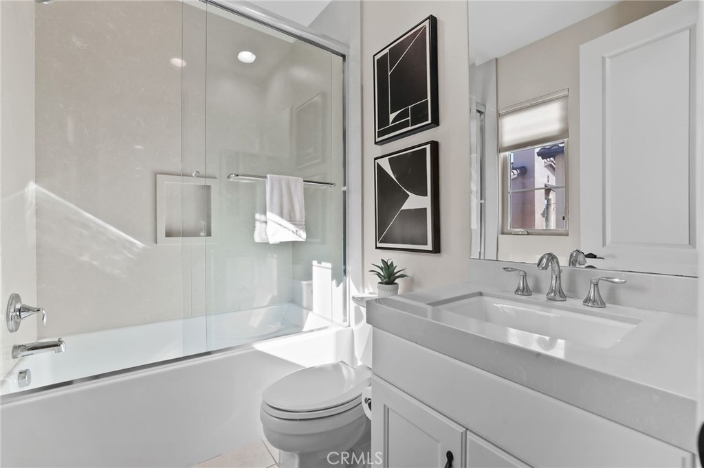 10 Shadybend Irvine, CA 92602 - Photo 36 of 70 a bathroom with a sink a toilet and shower
