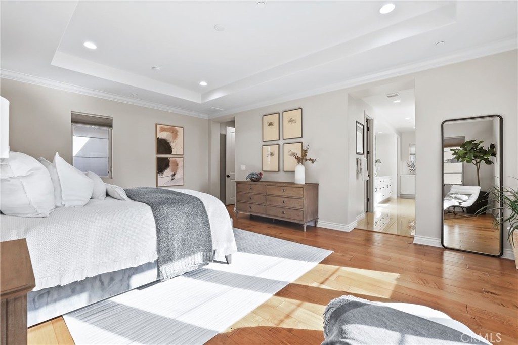 10 Shadybend Irvine, CA 92602 - Photo 42 of 70 a spacious bedroom with a bed a couch and a view of bedroom