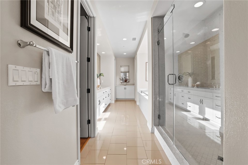 10 Shadybend Irvine, CA 92602 - Photo 43 of 70 a view of a hallway with wooden floor and a bathroom