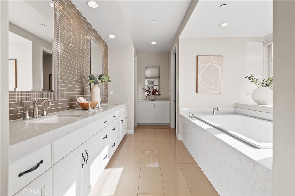 10 Shadybend Irvine, CA 92602 - Photo 44 of 70 a large white bathroom with a large tub sink and mirror