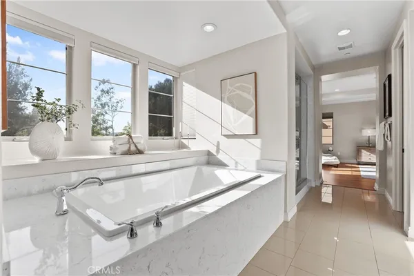 a view of a swimming pool with lounge chair