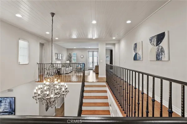 a view of a patio with table and chairs with wooden floor and fence