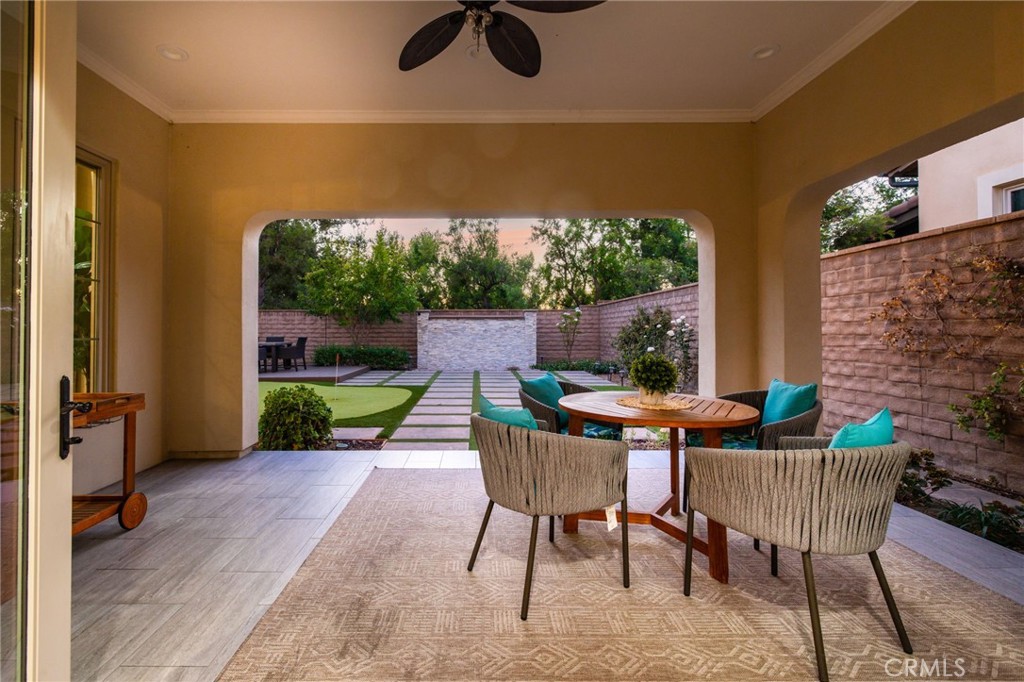 10 Shadybend Irvine, CA 92602 - Photo 58 of 70 a view of a patio with table and chairs potted plants with wooden floor