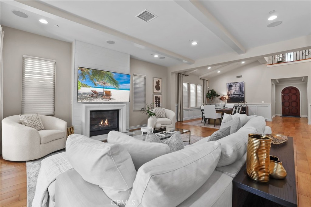 10 Shadybend Irvine, CA 92602 - Photo 8 of 70 a living room with furniture a fireplace and a flat screen tv