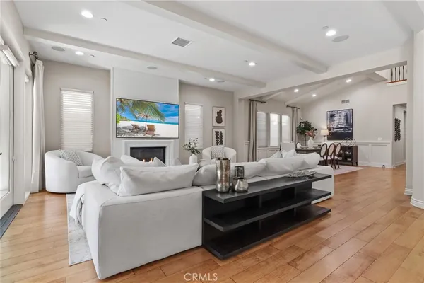 a living room with furniture and kitchen view