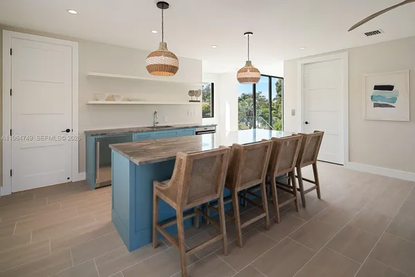 a dining room with furniture window and wooden floor