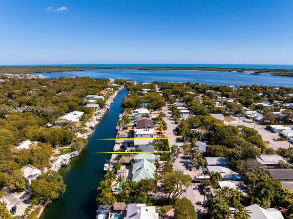 an aerial view of residential building with ocean view