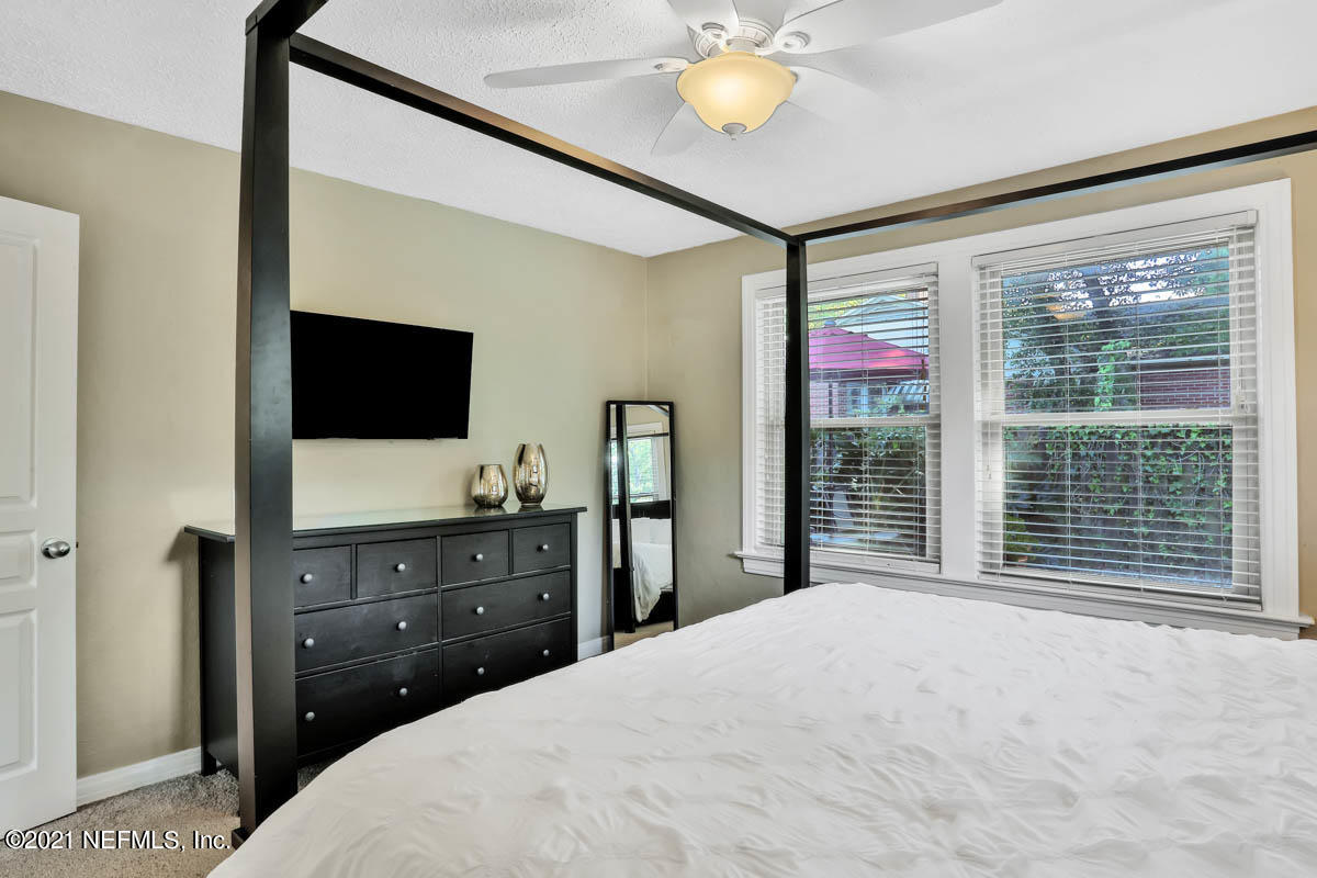 4116 Dover Road Jacksonville, FL 32207 - Photo 16 of 34 a bedroom with a bed and a flat screen tv