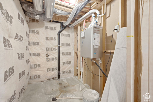 153 East Rochefort Court Sandy, UT 84070 - Photo 31 of 43 Tankless water heater, exposed ductwork, exposed framing, and insulated wall panels