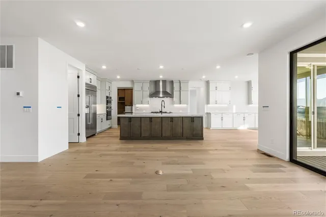 a view of a kitchen with a sink and cabinets